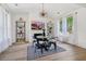 Bright dining room with hardwood floors, a round table, and built-in shelving at 334 Spotted Ridge Cir, Woodstock, GA 30188