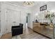 Elegant dressing room with a mirrored vanity, lighting, and stylish decor at 334 Spotted Ridge Cir, Woodstock, GA 30188