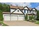 Charming two-story home with a three-car garage, landscaped front yard, and inviting curb appeal at 334 Spotted Ridge Cir, Woodstock, GA 30188