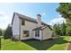 Exterior view of home showcasing the back patio, manicured lawn and siding at 334 Spotted Ridge Cir, Woodstock, GA 30188