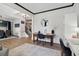 Home office with built-in shelving and view to staircase and dining room at 334 Spotted Ridge Cir, Woodstock, GA 30188
