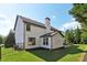 White two story house with black accents and large backyard at 334 Spotted Ridge Cir, Woodstock, GA 30188