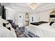 Spacious main bedroom with a large bed, decorative rug, and easy access to the en-suite bath at 334 Spotted Ridge Cir, Woodstock, GA 30188