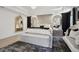 Luxurious main bedroom with a plush bed, elegant headboard, and large windows at 334 Spotted Ridge Cir, Woodstock, GA 30188