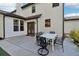 A concrete patio features an outdoor dining set, perfect for enjoying meals al fresco at 334 Spotted Ridge Cir, Woodstock, GA 30188