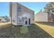 Tan house with backyard, grass, and patio at 7618 Mcgillicuty Dr, Union City, GA 30291