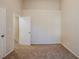 Bedroom with door to hallway and carpet at 7618 Mcgillicuty Dr, Union City, GA 30291