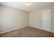 Bright bedroom featuring neutral walls and carpeted floors at 7618 Mcgillicuty Dr, Union City, GA 30291