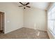 Bright bedroom with ceiling fan and large window at 7618 Mcgillicuty Dr, Union City, GA 30291