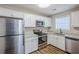 Modern kitchen featuring stainless steel appliances and white cabinets at 7618 Mcgillicuty Dr, Union City, GA 30291