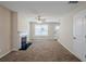 Spacious living room featuring a fireplace and neutral carpeting at 7618 Mcgillicuty Dr, Union City, GA 30291