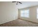 Spacious bedroom with vaulted ceiling, large window and neutral carpet at 7618 Mcgillicuty Dr, Union City, GA 30291