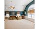 Spacious bonus room with vaulted ceiling and teal walls at 2650 The Terraces Way, Dacula, GA 30019