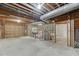 Unfinished basement with exposed utilities and garage access at 2691 Willow Green Dr, Duluth, GA 30096