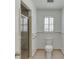 Small bathroom with shower, toilet and single sink at 2691 Willow Green Dr, Duluth, GA 30096