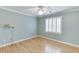 Light-filled bedroom with hardwood floors and window shutters at 2691 Willow Green Dr, Duluth, GA 30096