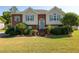 Two-story home with a brick facade and a grassy lawn at 4171 High Country Dr, Douglasville, GA 30135