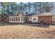 Brick house with sunroom and patio at 4852 Brownsville Rd, Powder Springs, GA 30127