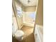 Clean bathroom features a tub with shower, tile floors, and modern fixtures at 869 Meadow Rock Way, Stone Mountain, GA 30083