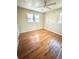 Spacious bedroom with hardwood flooring, bright windows, and neutral colors at 869 Meadow Rock Way, Stone Mountain, GA 30083