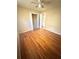 A bedroom with hardwood floors, a ceiling fan, and closet space at 869 Meadow Rock Way, Stone Mountain, GA 30083