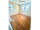Bright bedroom with hardwood floors, two windows and white trim at 869 Meadow Rock Way, Stone Mountain, GA 30083