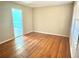 Bright living room featuring hardwood floors and ample natural light, creating a warm and inviting space at 869 Meadow Rock Way, Stone Mountain, GA 30083
