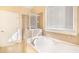 Bathroom boasts a large garden tub and walk-in shower at 232 Baywood Ln, Villa Rica, GA 30180