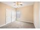 Spacious bedroom with double doors and ceiling fan at 232 Baywood Ln, Villa Rica, GA 30180