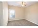 Bright bedroom with ceiling fan and neutral carpeting at 232 Baywood Ln, Villa Rica, GA 30180
