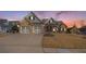 Two-story house with stone accents and three-car garage at 232 Baywood Ln, Villa Rica, GA 30180