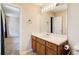 Neat bathroom with a vanity, mirror, and single sink at 40 Apache Ct, Locust Grove, GA 30248