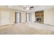 Living room featuring a stone fireplace and neutral decor at 40 Apache Ct, Locust Grove, GA 30248