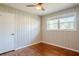 Bedroom with hardwood floors, wainscoting and ceiling fan at 2756 Plantation Dr, East Point, GA 30344