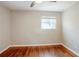 Simple bedroom with hardwood floors and a window at 2756 Plantation Dr, East Point, GA 30344