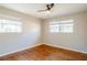 Charming bedroom with hardwood floors and two windows at 2756 Plantation Dr, East Point, GA 30344