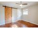 Bright bedroom with hardwood floors and barn door at 2756 Plantation Dr, East Point, GA 30344