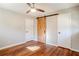 Well lit bedroom featuring hardwood floors and a ceiling fan at 2756 Plantation Dr, East Point, GA 30344