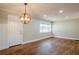 Bright dining room with hardwood floors and a unique light fixture at 2756 Plantation Dr, East Point, GA 30344