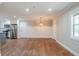 Spacious dining area with hardwood floors and a globe light fixture at 2756 Plantation Dr, East Point, GA 30344