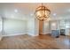 Open dining area with hardwood floors and kitchen view at 2756 Plantation Dr, East Point, GA 30344