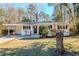 Charming ranch home with a well-manicured lawn and mature trees at 2756 Plantation Dr, East Point, GA 30344