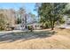 Ranch home with a spacious front yard and tree-lined street at 2756 Plantation Dr, East Point, GA 30344