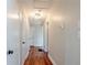 Bright hallway with hardwood floors and neutral walls at 2756 Plantation Dr, East Point, GA 30344