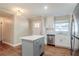 Renovated kitchen with white cabinets, stainless steel appliances, and an island at 2756 Plantation Dr, East Point, GA 30344