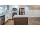 Modern kitchen with white cabinets, stainless steel appliances and island at 2756 Plantation Dr, East Point, GA 30344