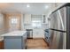 Updated kitchen with white cabinets, stainless steel appliances, and a large island at 2756 Plantation Dr, East Point, GA 30344