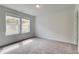 Bright bedroom with carpeted floor and two large windows at 3172 Washburn Sw St, Atlanta, GA 30354