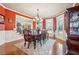 Formal dining room with hardwood floors and large windows at 4802 Moon Chase Dr, Buford, GA 30519