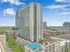 High-rise residential building with a pool and city views at 860 Peachtree Ne St # 2513, Atlanta, GA 30308